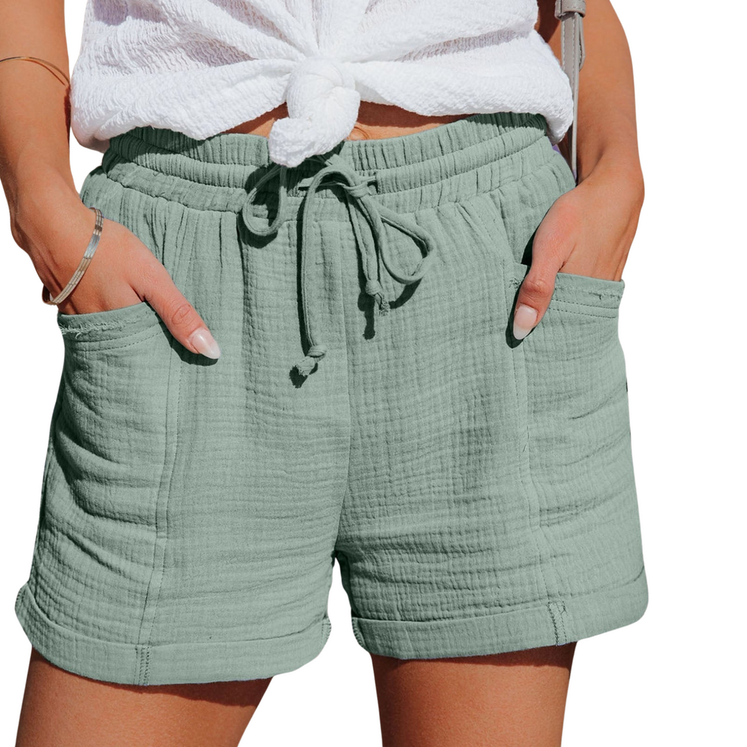 Women's casual shorts in relaxed fit with convenient front pocket for everyday wear.