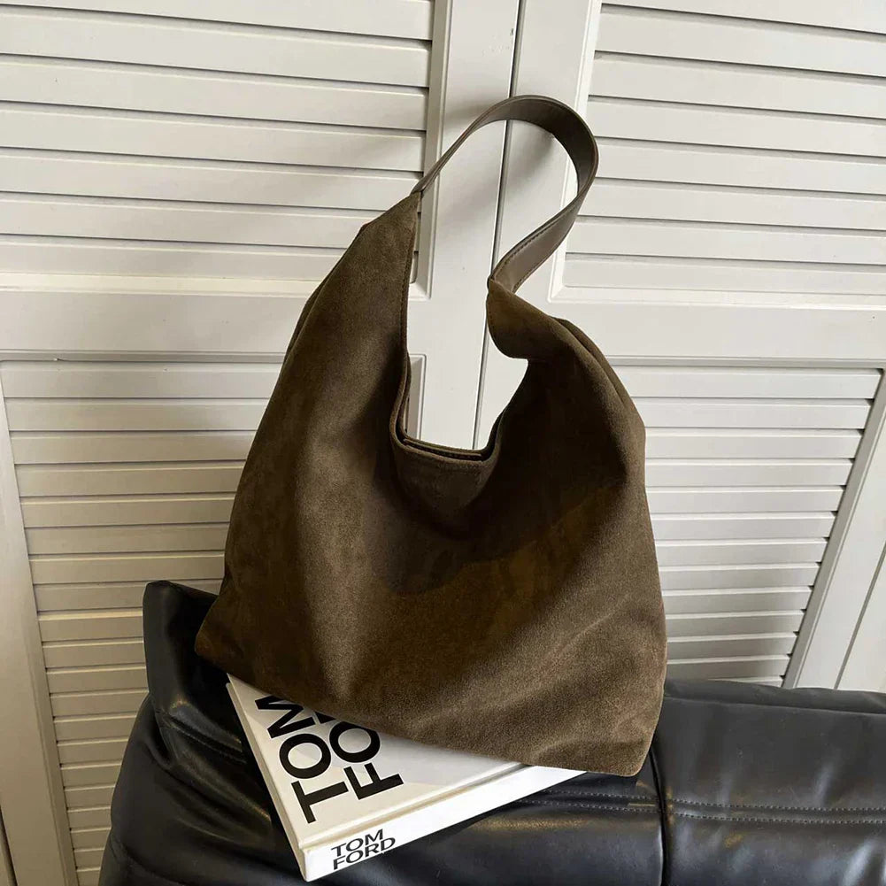 Casual women's shoulder tote bag for travel & daily use. Spacious, stylish, and a versatile carryall.