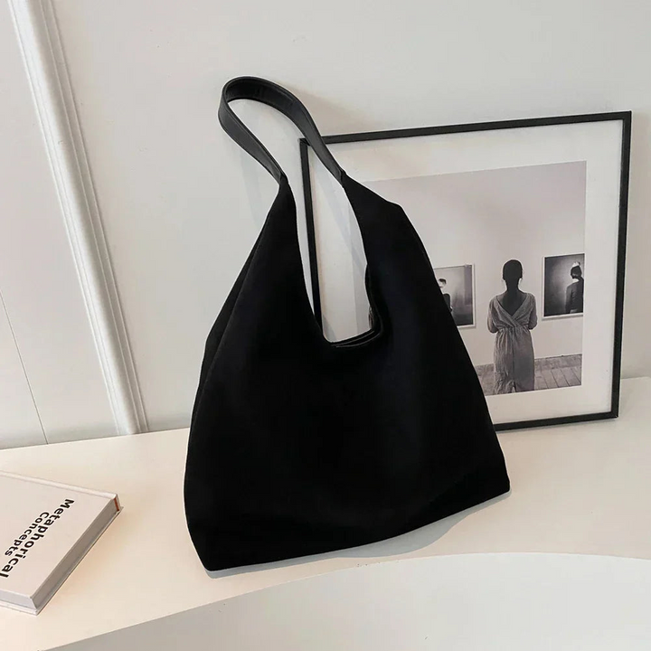 Reliable women's travel tote bag, a casual shoulder carryall ideal for vacations or busy everyday life.