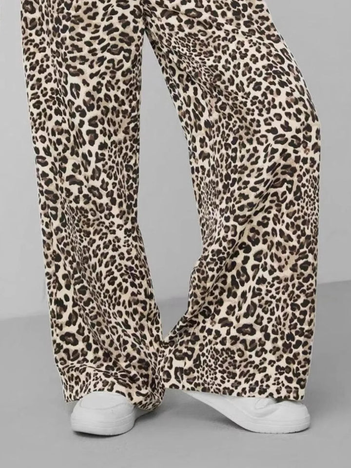 Detail shot of the drawstring closure on comfortable women's leopard print wide leg pants.