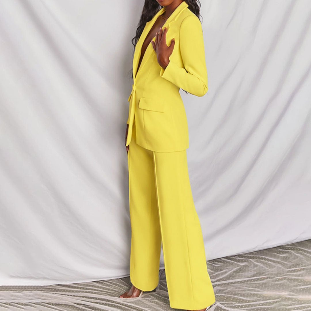 Women's elegant tailored blazer and slim-fit trousers suit set, ideal for office.