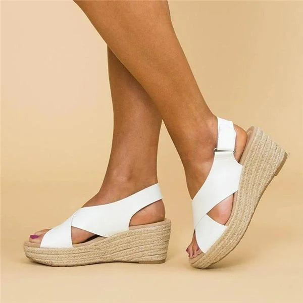 A woman wearing Clara orthopedic wedge espadrilles, demonstrating casual yet dressy style.