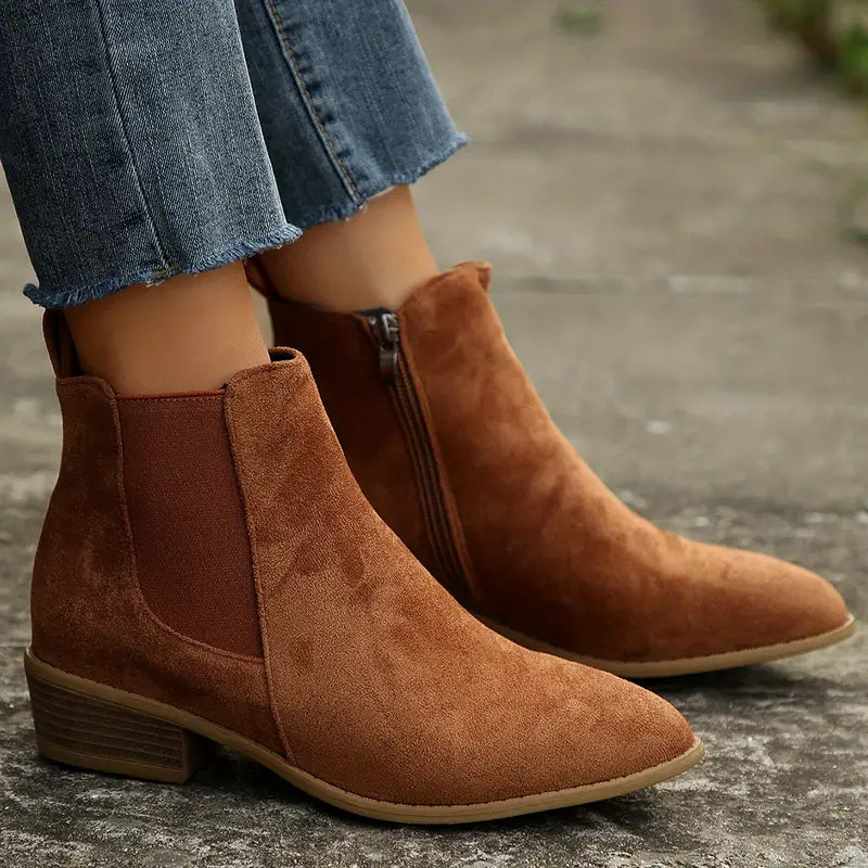Women's classic black Chelsea ankle boots with elastic side panels for easy pull-on style.