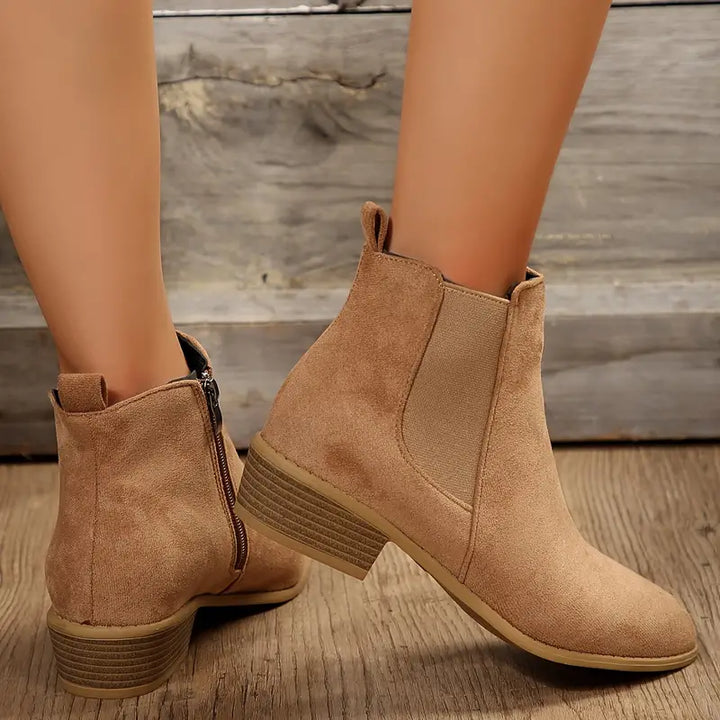 Comfortable women's ankle boots in a classic Chelsea design, ideal for all-season wear.