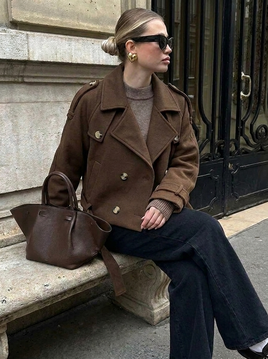 Stylish women's chocolate brown cropped trench coat, perfect fall outerwear with classic double-breasted design.