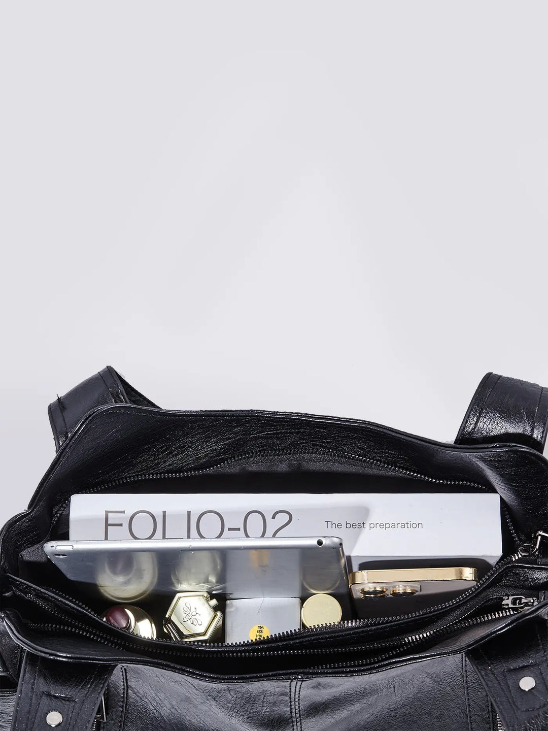 Stylish black leather multi-pocket handbag for women, perfect for work or travel