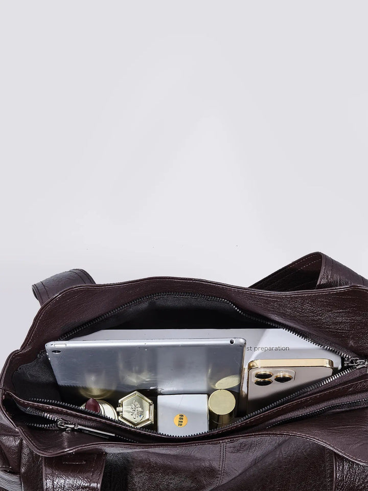 Genuine leather women's bag in a classic brown hue, offering practical style