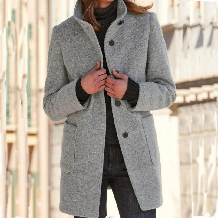 Elegant dark blue wool coat for women, featuring vintage buttons