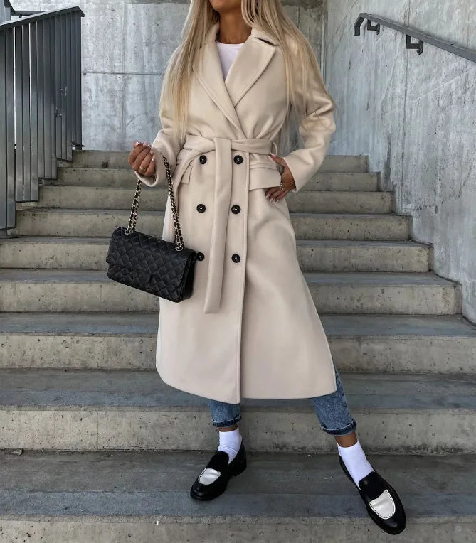Sophisticated women's classic trench coat with long sleeves, featuring a timeless design perfect for elegant layered looks.