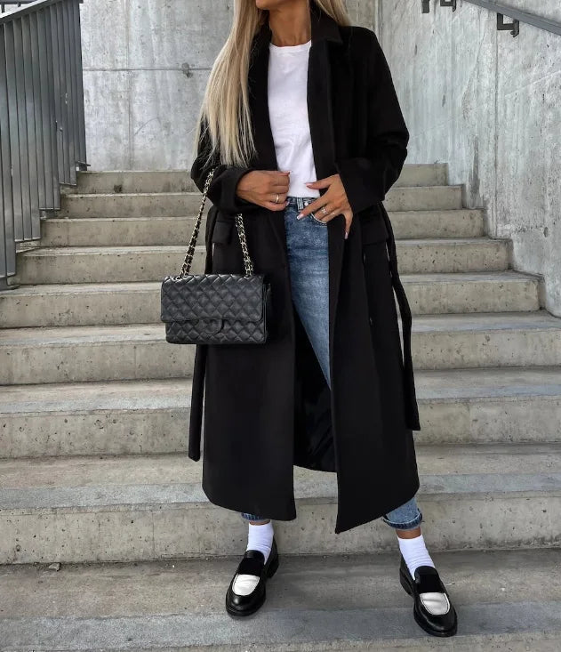 Chic women's long sleeve trench coat. Classic design, perfect elegant outerwear for a sophisticated and timeless winter look.