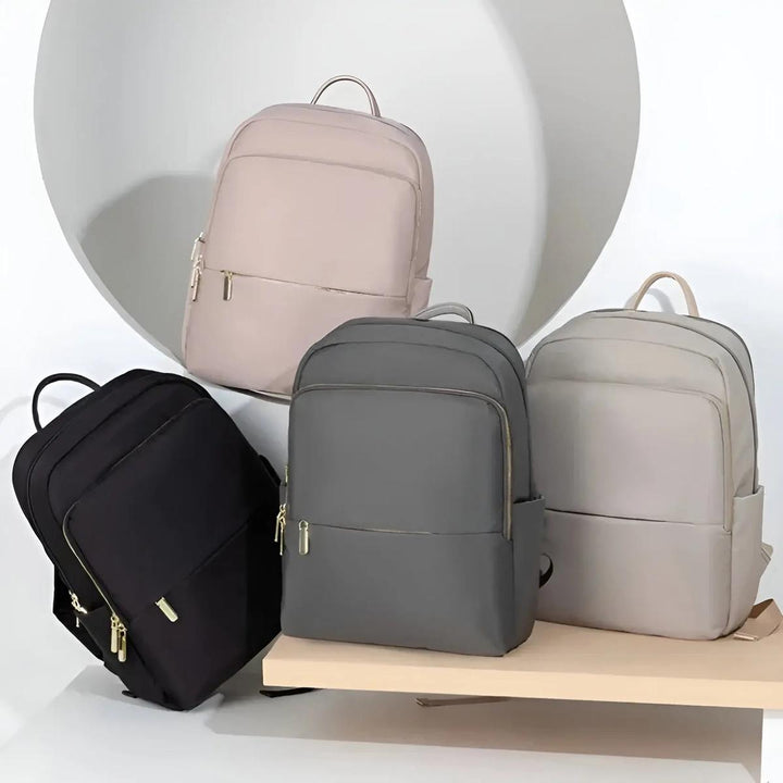 Chic pink women's waterproof laptop backpack. A stylish and practical choice for daily essentials.