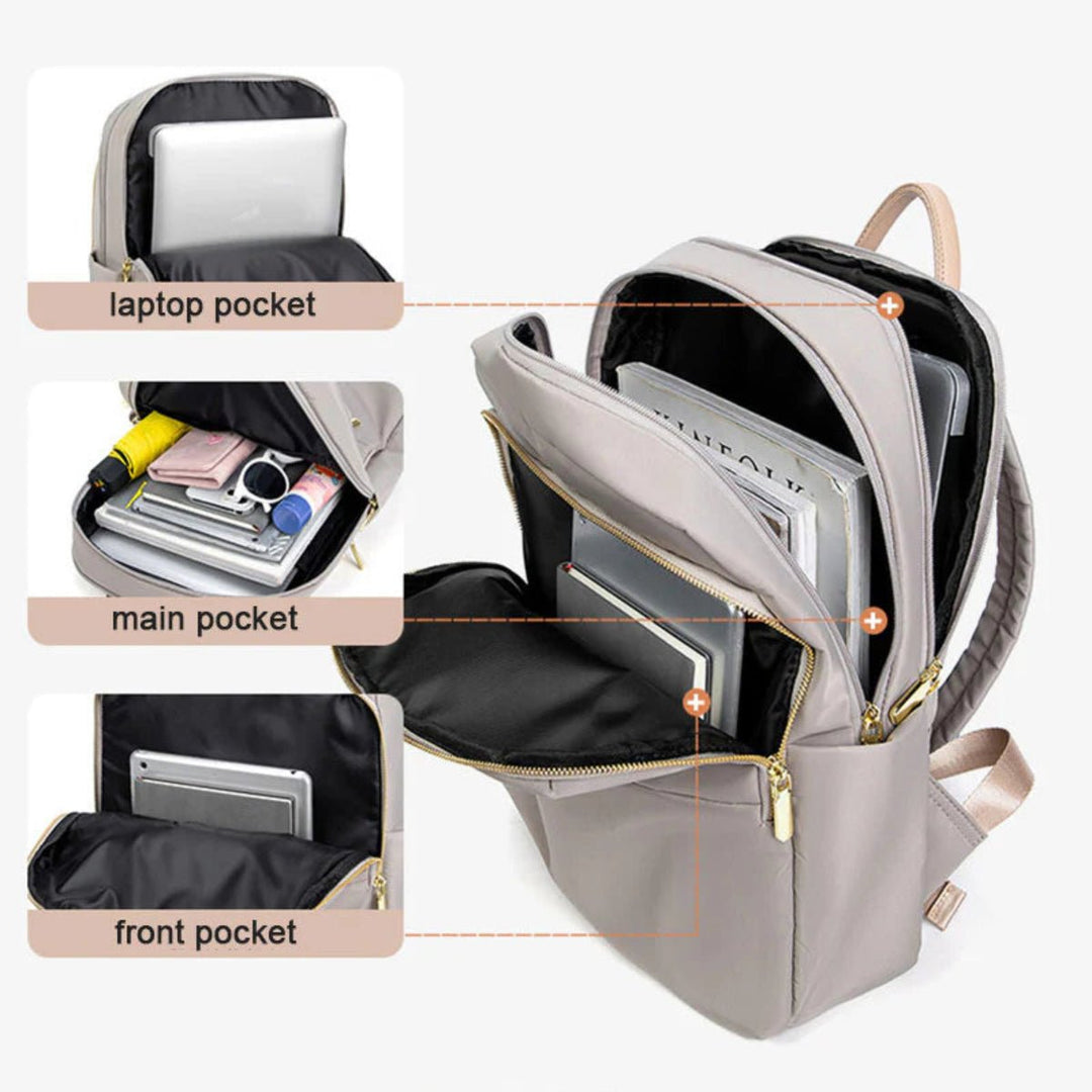 Durable women's waterproof laptop backpack, protecting electronics for school, work & travel.