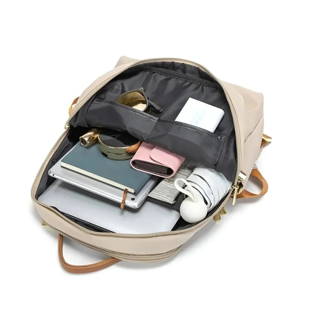 Elegant minimalist women's waterproof laptop backpack. Perfect for sophisticated daily carry.