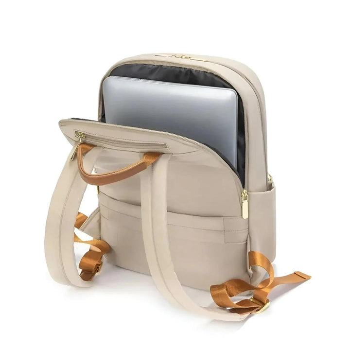 Women's waterproof commuter backpack with laptop sleeve. Keeps work essentials dry and organized.