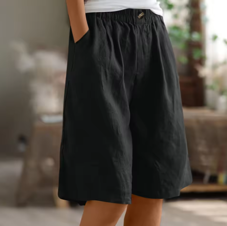 Women's everyday wear shorts in a vibrant coral color.