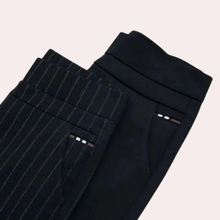 Comfortable black high-waisted stretch trousers for women, ideal for casual outings or relaxed office environments.