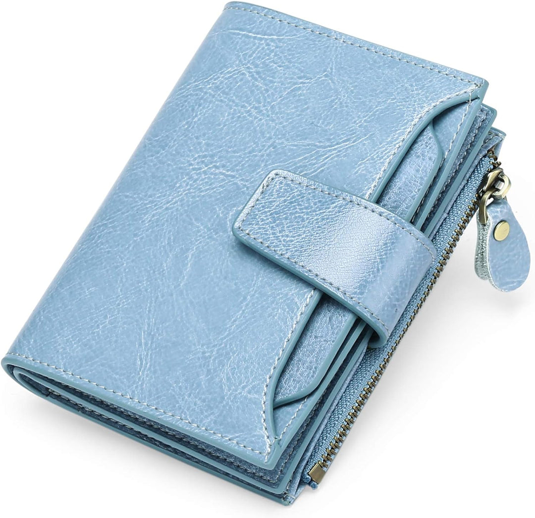 Women's compact RFID blocking leather wallet with multiple card slots & coin pocket for secure organizing.