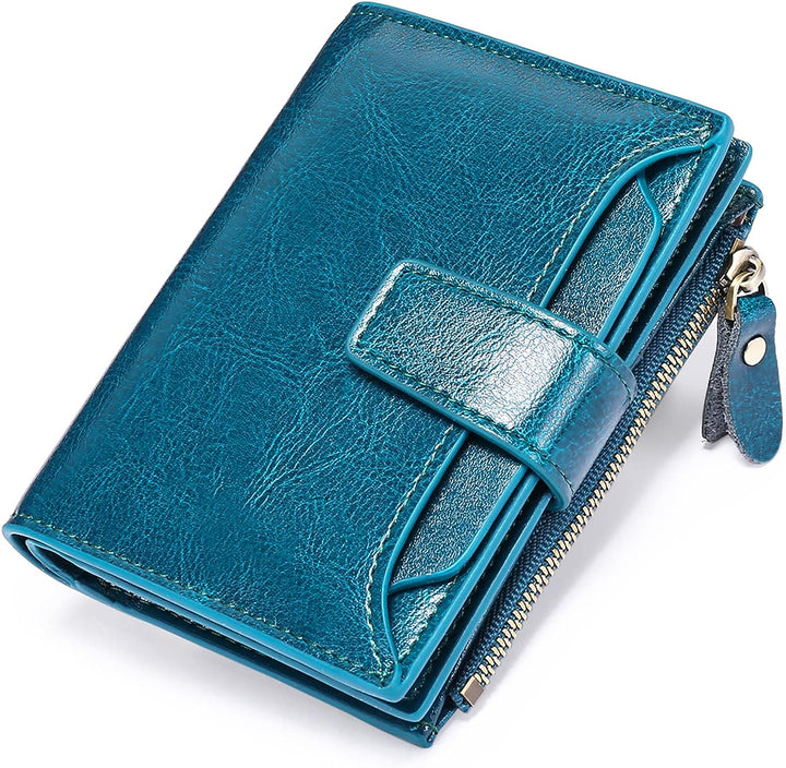 Open women's RFID blocking leather wallet displaying various card slots, ID window, and zipped coin pouch.