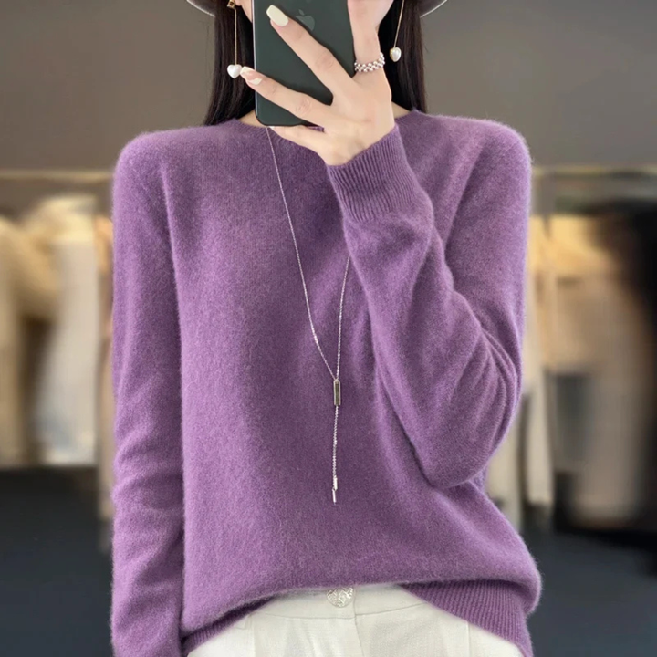 Fashionable women's cozy crewneck pullover sweater. Soft warm knit, perfect for winter outfits.