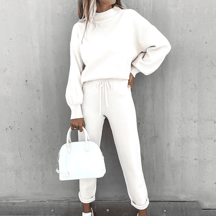 Relaxed fit women's two-piece loungewear set with soft turtleneck top and comfortable high-waist pants.