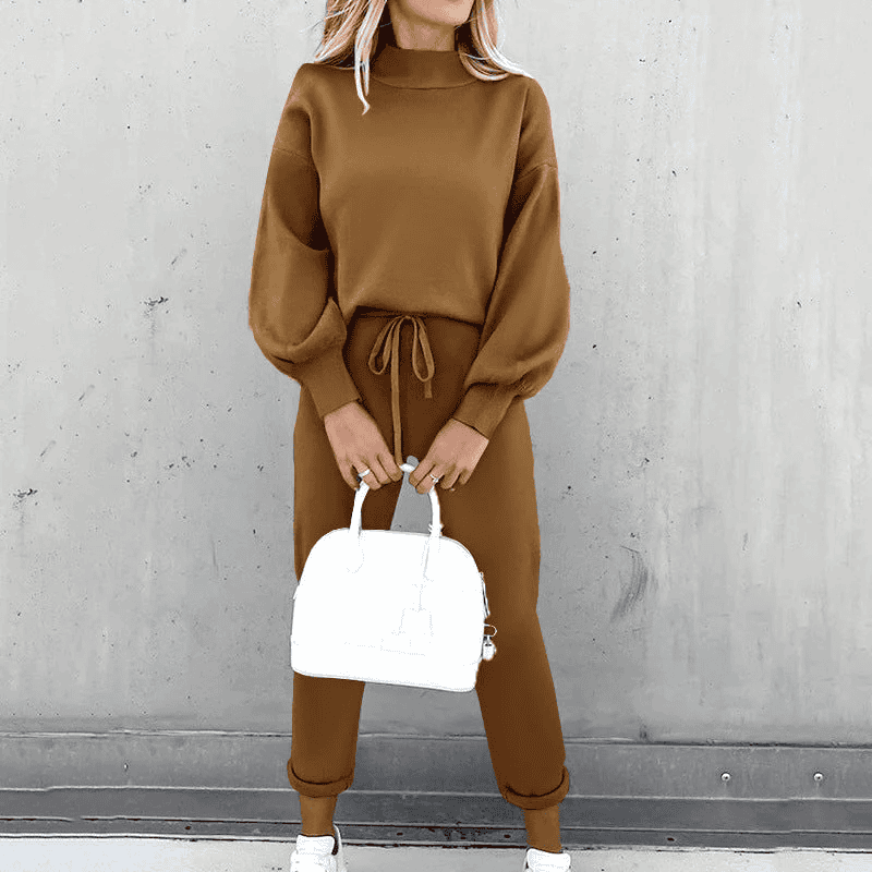 Chic women's cozy loungewear set: modern turtleneck top and flattering high-waist pants for relaxed comfort.