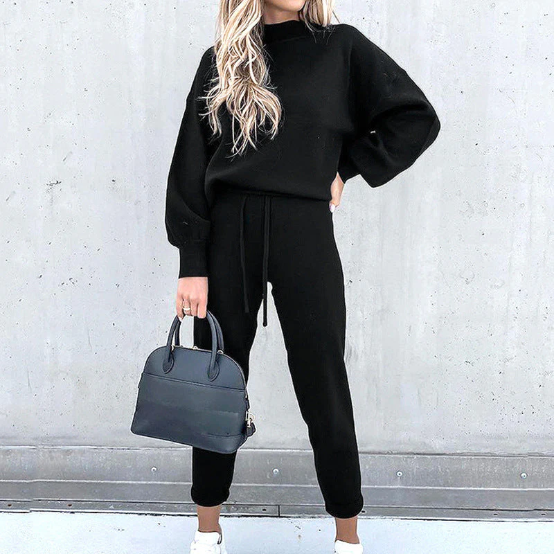 Fashionable women's relaxed fit loungewear set with a cozy turtleneck top and comfortable high-waist pants.