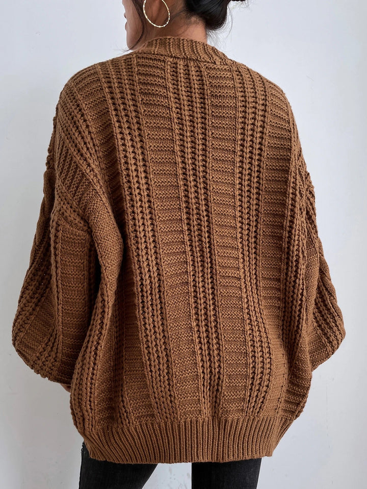 Stylish oversized cable knit cardigan for women, ideal for casual and chic winter fashion.