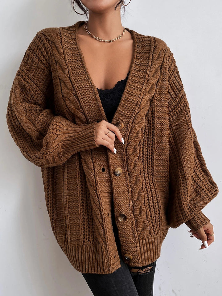 Warm and cozy women's oversized cable knit cardigan, essential fall & winter fashion for layering.