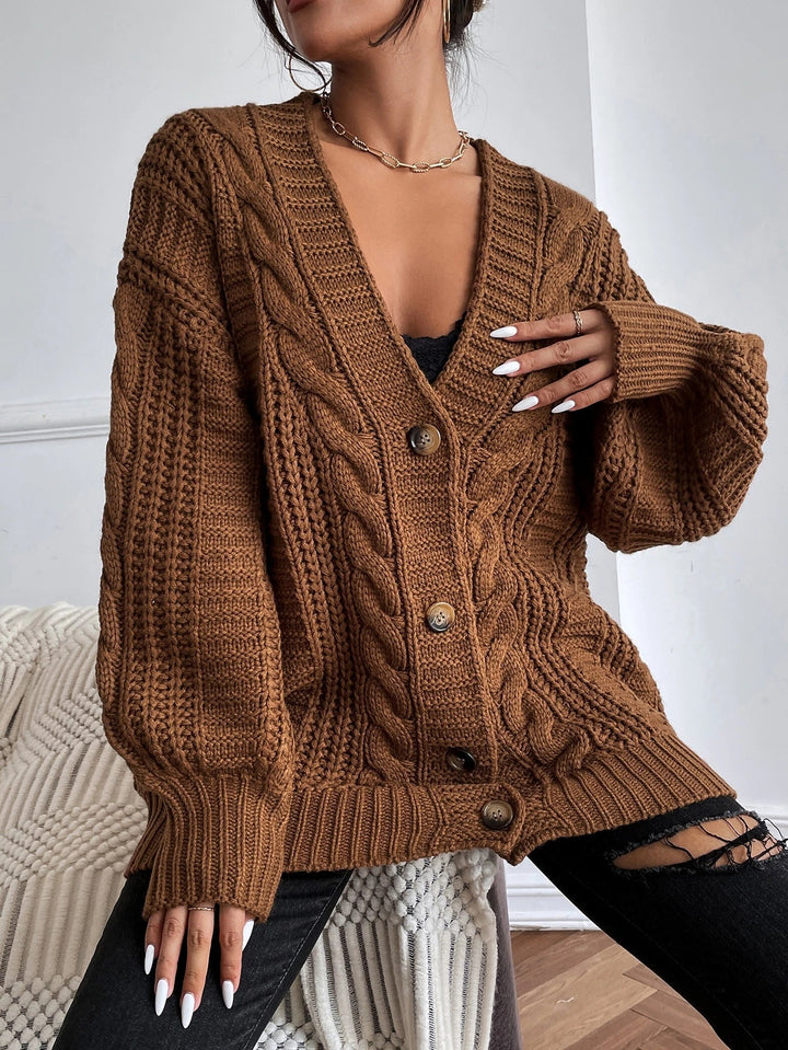 Soft women's oversized cable knit cardigan, perfect comfortwear for casual and stylish looks.