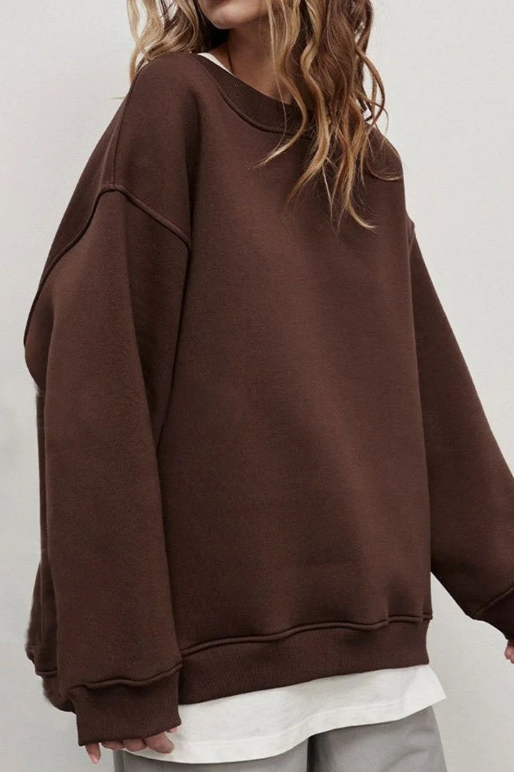 Stylish women's oversized round neck pullover sweatshirt, featuring a loose fit for ultimate comfort.
