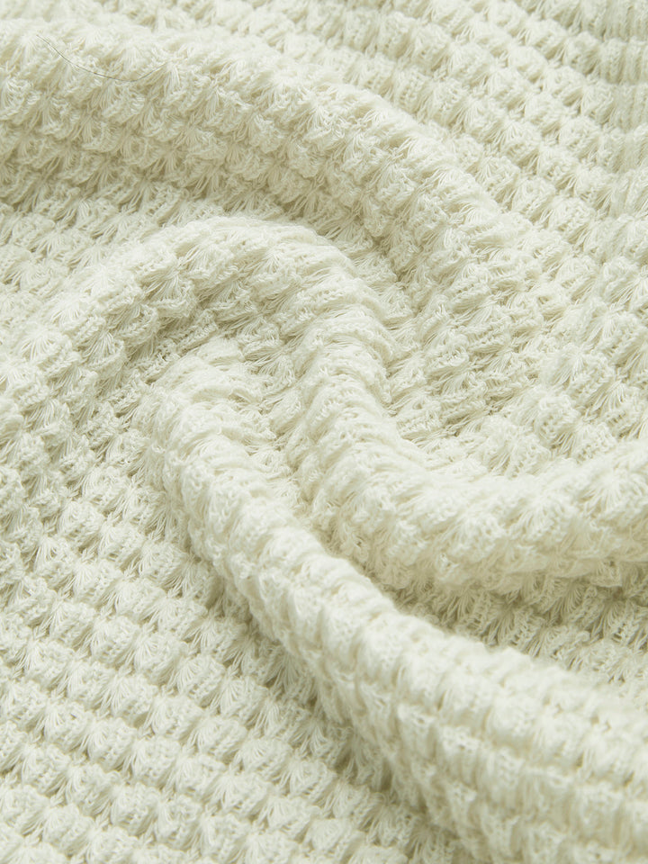 Comfortable women's long sleeve waffle knit top, offering a cozy feel for everyday wear.