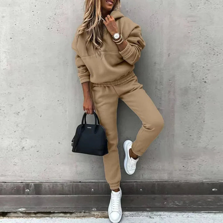 Sporty women's full-zip tracksuit set with joggers, ideal for casual wear & comfort.