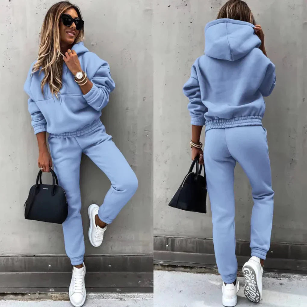 Black women's full-zip sporty tracksuit, a cozy winter activewear and loungewear set.