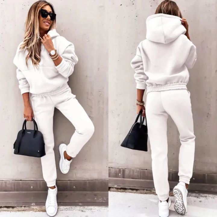 Blue women's winter jogger set, cozy activewear with full-zip hoodie for comfort & style.