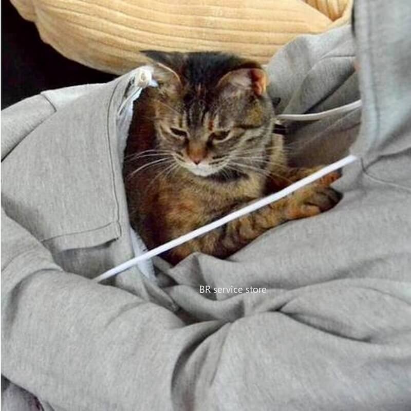 Close-up of a women's CozyPurr hoodie, showcasing the deep, cozy cat pouch for pet snuggles.