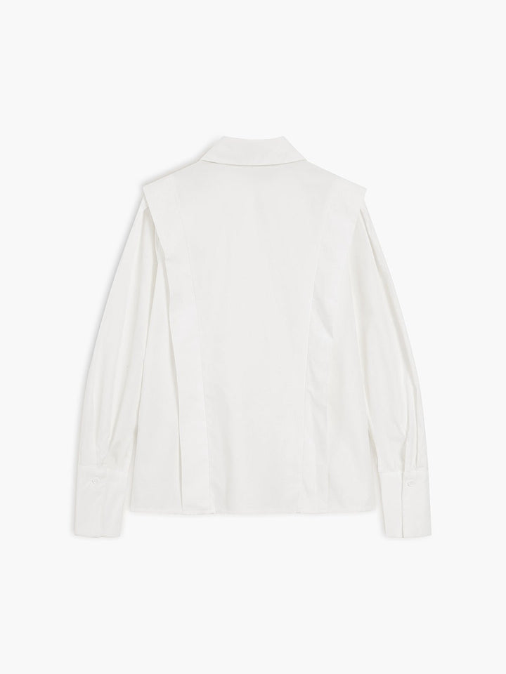 Front view of a women's crisp button-down shirt, showcasing its tailored fit.