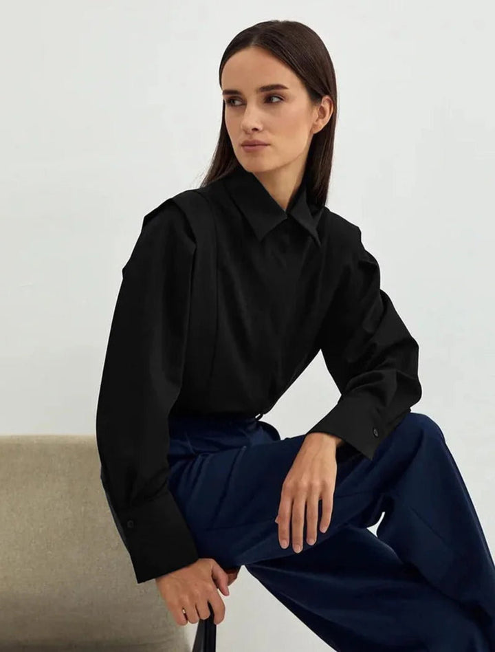 Detailed shot of buttons and collar on an elegant women's crisp shirt.