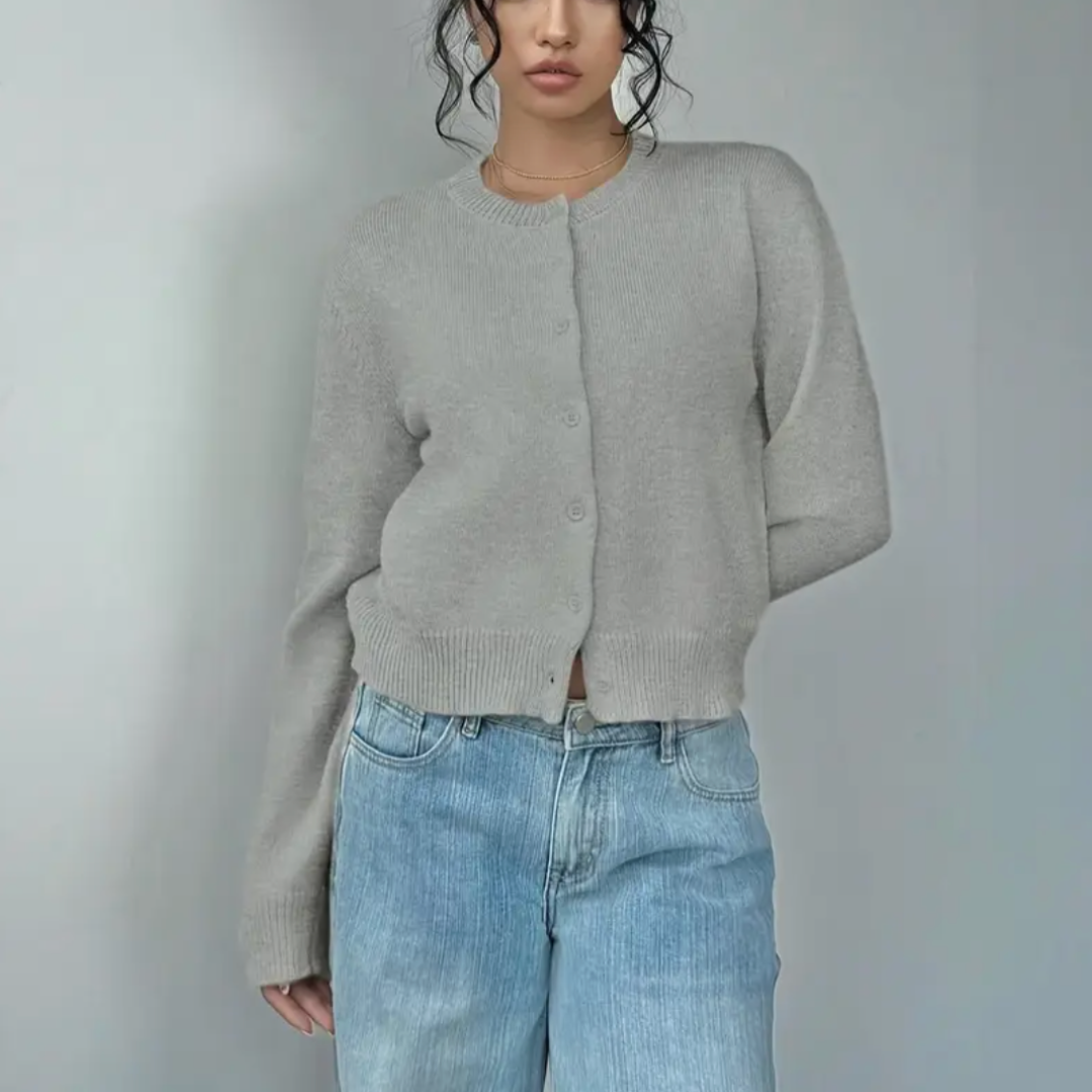 Short length women's cropped cardigan, a chic button-front layer with ribbed cuffs & hem.