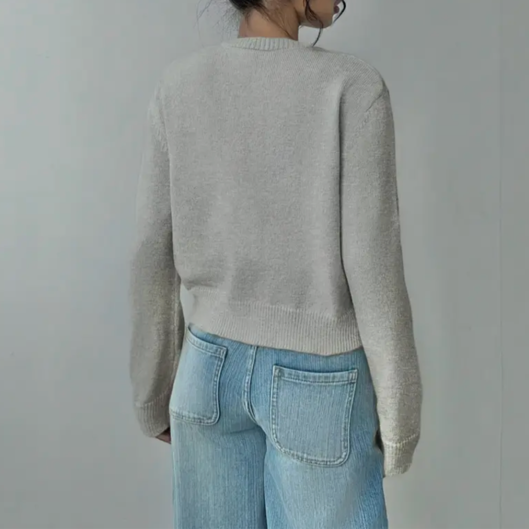Modern ladies fashion: cropped button-front cardigan, featuring flattering ribbed trim for any outfit.