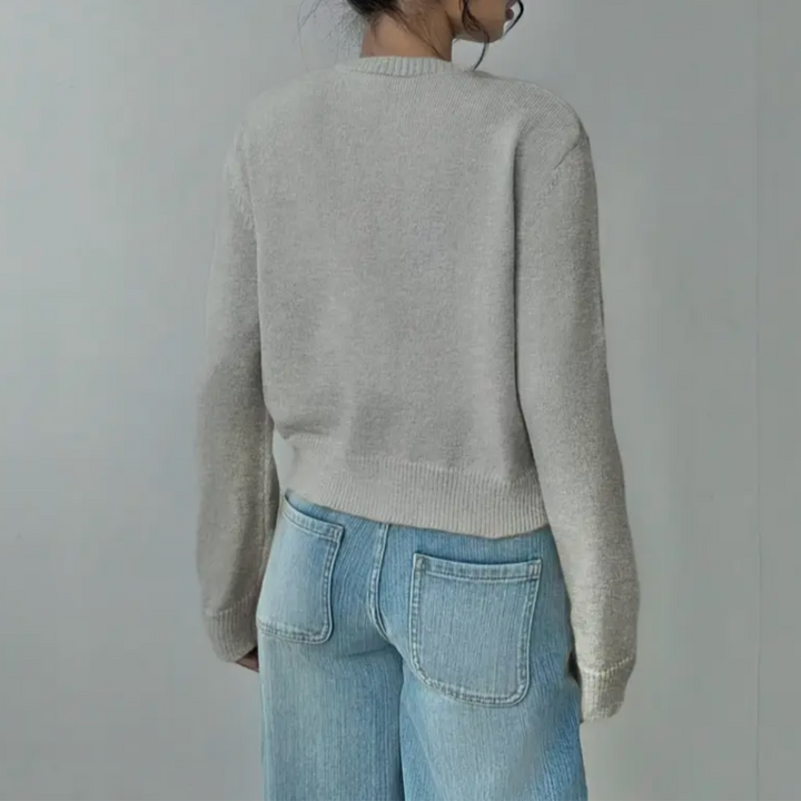 Modern ladies fashion: cropped button-front cardigan, featuring flattering ribbed trim for any outfit.