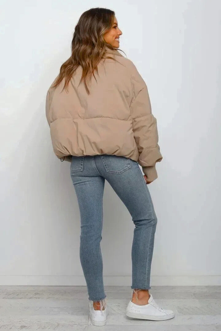 Fashionable cropped puffer jacket for women with quilting.