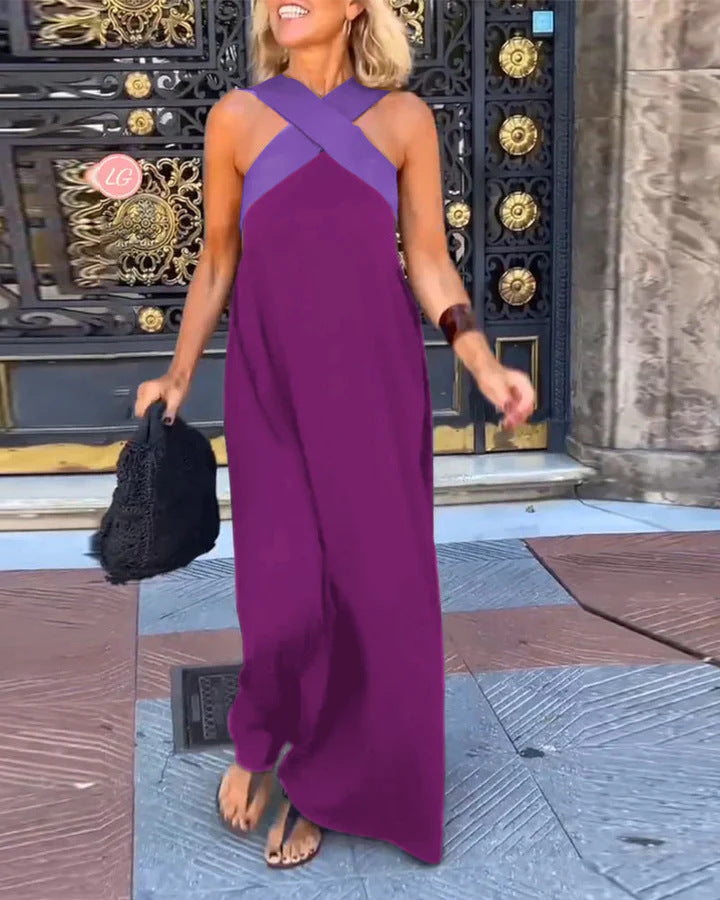 Chic women's maxi dress featuring an elegant crossed front and floral pattern.