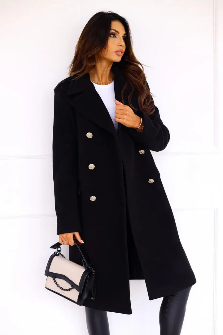 Elegant women's double-breasted long coat, perfectly tailored, featuring luxurious gold buttons.