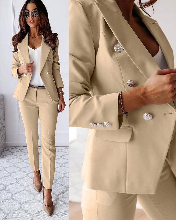 Close-up of the structured shoulders on a women's double-breasted tailored suit.