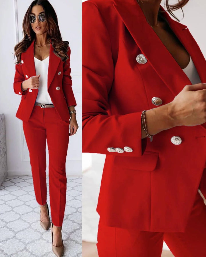 Model wearing a chic women's double-breasted pantsuit for professional evening wear.