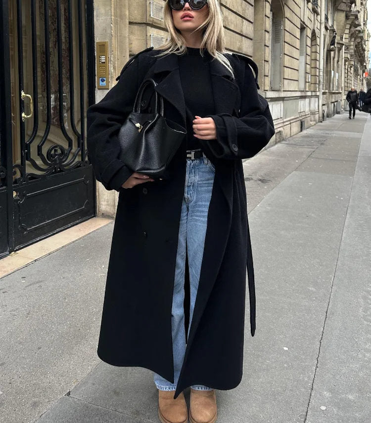 Versatile black double-breasted trench coat for women. Perfect elegant and sophisticated fall/winter outerwear.