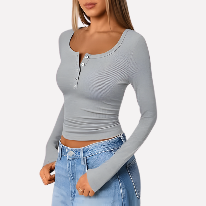 Comfortable women's long sleeve Henley shirt with ribbed texture and button placket, designed for effortless style.