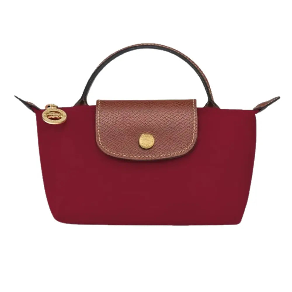 Elan mini bag worn across the body, showing its versatility and compact form.
