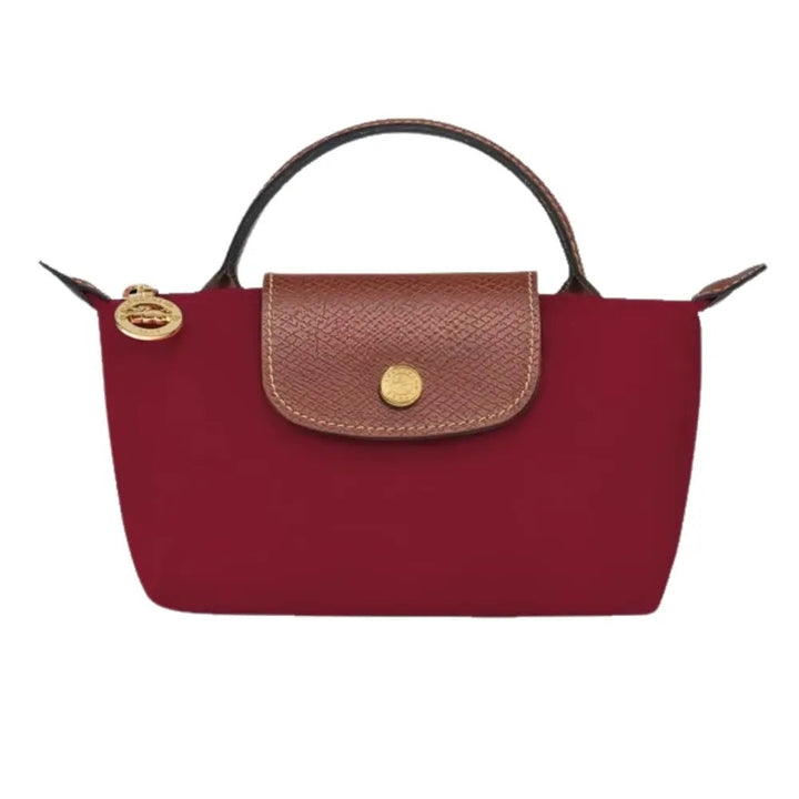 Elan mini bag worn across the body, showing its versatility and compact form.