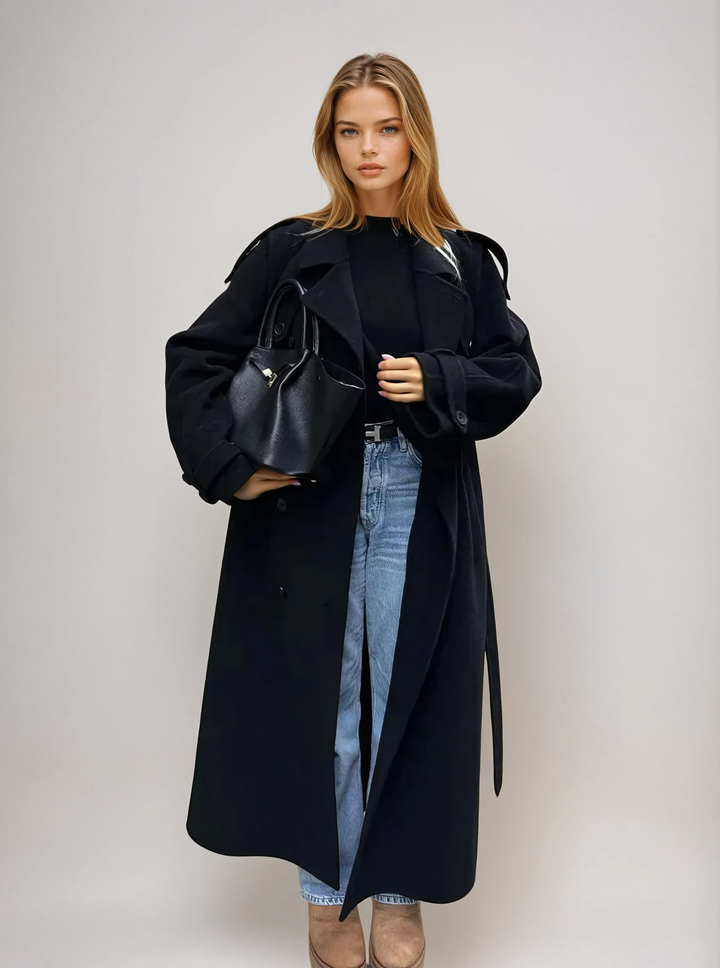 Women's elegant black double-breasted longline coat, perfect for sophisticated winter fashion.